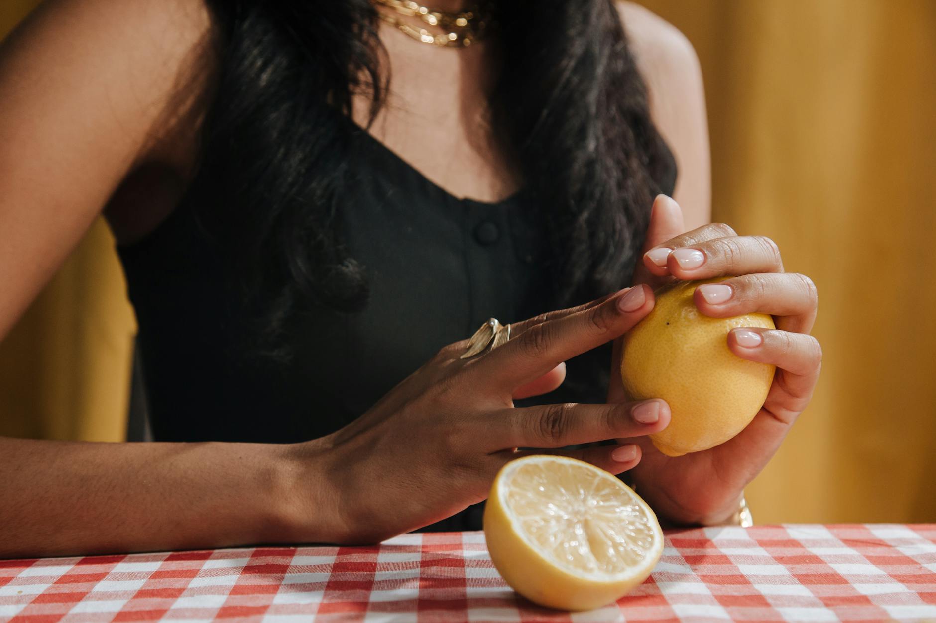 A hand holding a vibrator against a minimalistic backdrop, exploring sensation without pressure